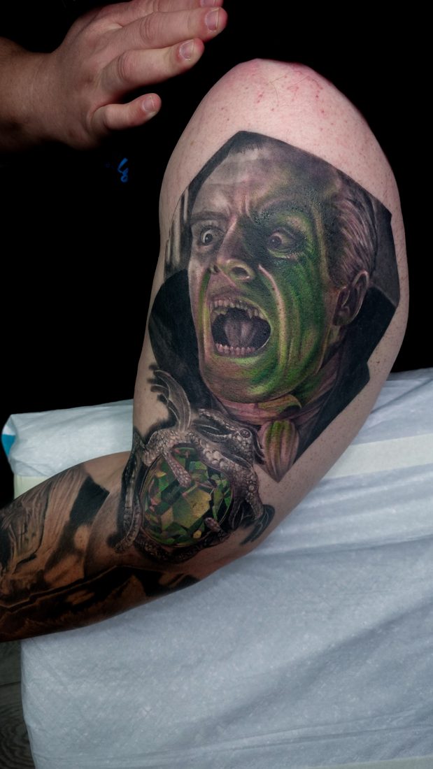 Colour portrait tattoo on a shoulder